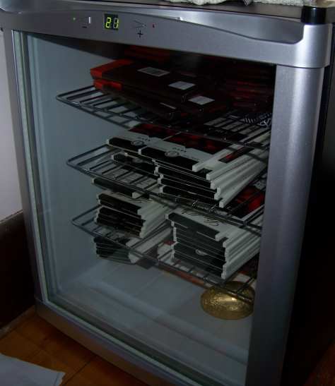 A small fridge full of chocolate