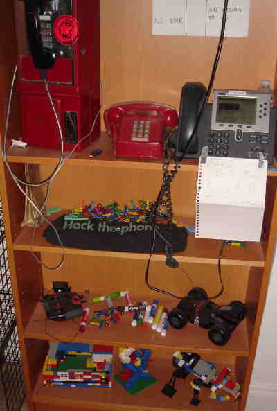 VOIP phone in use, pay-phone for decoration, and Magnetix