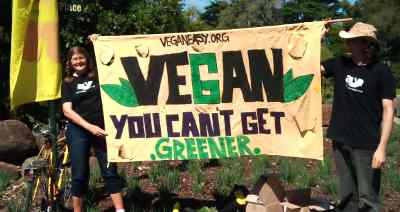 Vegans waving a banner for VeganEasy.org