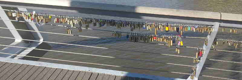 Locks with inscriptions on a bridge on the Yarra River in Melbourne